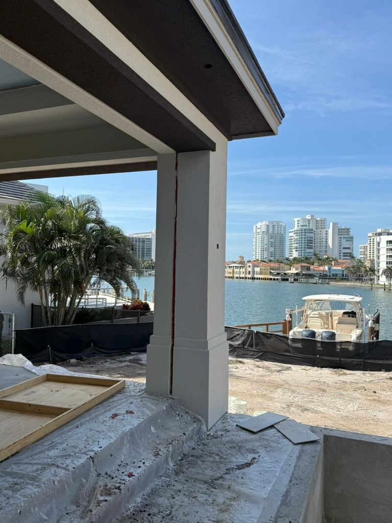 813a77c6-e8d5-4e53-a871-7f93dd1cd38c Waterfront property under construction with city view.